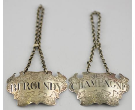 A pair of early 19th Century silver decanter labels, Champagne and Burgundy