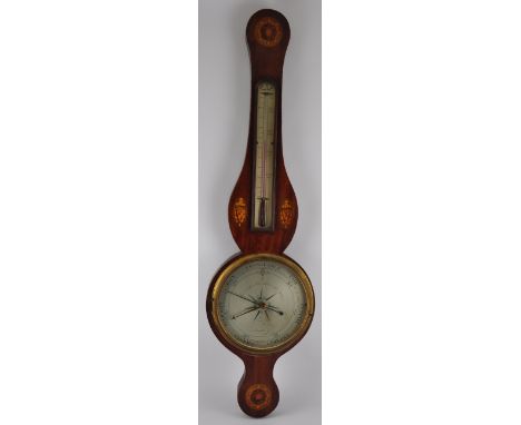 A George III mahogany wheel barometer / thermometer by Somalvico, London with engraved silvered scales within a satinwood pat