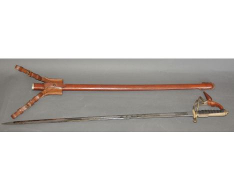 George VI officers dress sword with wire bound fish skin grip, three bar steel hilt and tan leather scabbard formerly the pro