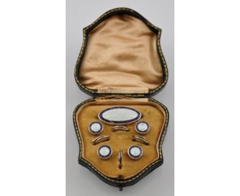 A Victorian silver and guilloche enamel dressing set within original green leather and gilt tooled case