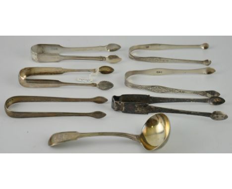 Six pairs of George III bright cut and thread pattern sugar tongs together with a fiddle and thread sauce ladle, 9oz