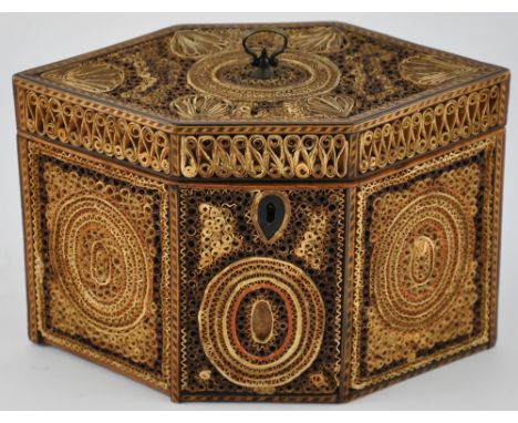 A George III hexagonal rolled paperwork tea caddy with original lidded interior, the panels divided by chequer inlaid boxwood