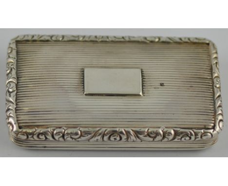 A George III silver snuff box, rectangular ribbed, the hinged cover with floral scroll border, Birmingham, circa 1820, by Jos