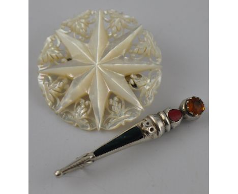 An antique Mother of Pearl Bethlehem star brooch and celtic silver agate brooch