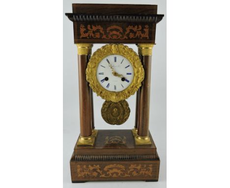 A late 19th Century French marquetry inlaid rosewood and ormulu portico mantel clock with 8 day drummovement striking on a be