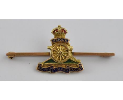 A 9ct gold artillery badge with polychromatic enamel highlights