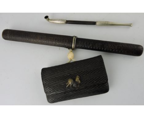 A Japanese Edo period, smoking pipe with a white metal Rattan Kiserazutsu mount, in a fitted pipe holder with attached pouch 
