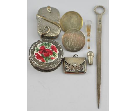 A George III poultry skewer, two Georgian silver buttons, a silver stamp box, a silver pillbox with enamel pull off cover, an