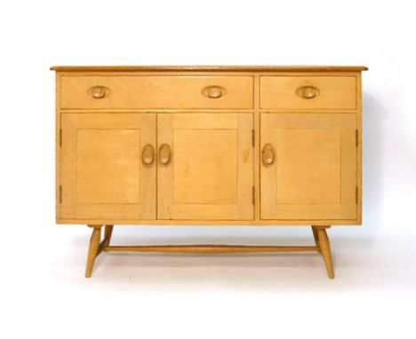 An Ercol elm and beech sideboard with an arrangement of two drawers and three doors on tapering feet, l. 122 cm CONDITION REP