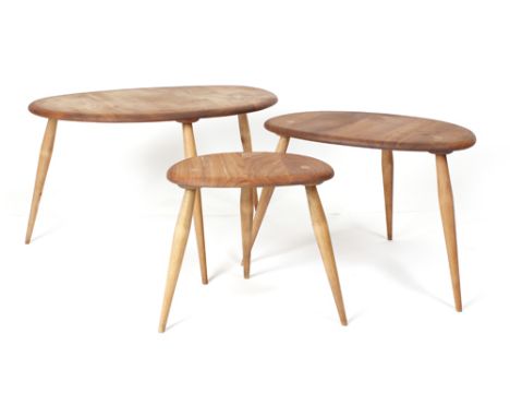 A nest of three Ercol elm and beech coffee tables, max w. 66 cm CONDITION REPORT: Surface of wood 'flat'. Typical wear. Been 