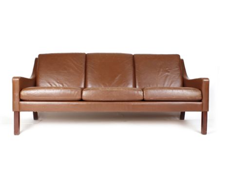 A three seater brown leather sofa on square feet in the manner of Borge Mogensen, w. 174 cm