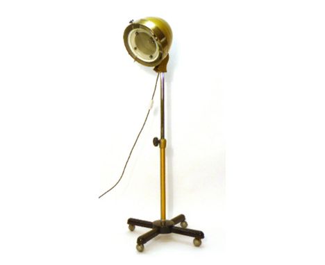 A Charles Alexander & Co. hair-dryer, converted into a lamp, on a polished aluminium and yellow adjustable shaft  CONDITION R