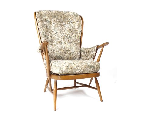 An Ercol highback open lounge armchair