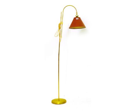 A 1970's brass coloured adjustable standard lamp with a U-shaped shaft CONDITION REPORT: Working order unknown, knocks and de