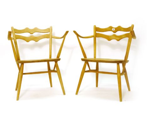 A pair of Ercol elm and beech ladderback armchairs CONDITION REPORT: Stripped back but structurally sound