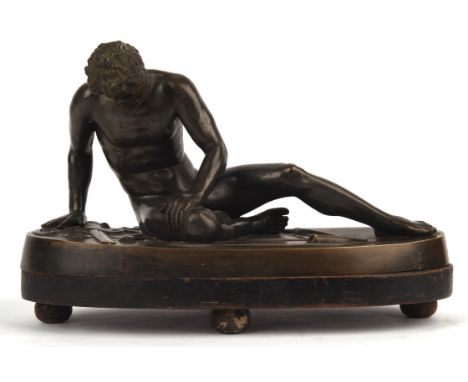 After the Antique. A Bronze of A Dying Gladiator on a bronze base and wooden stand, 30cm x 15cmCondition Report:  wear light 