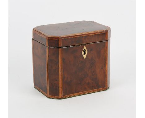 An early 19th century yew wood tea caddy of canted rectangular form with kingwood cross banded inlay.  Height 12.5cm