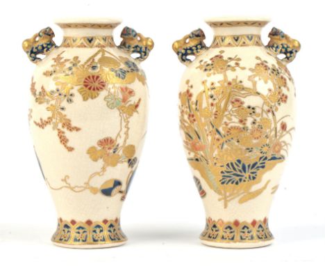 A pair of small Satsuma tapering oviform vases; each with karashishi handles; decorated in gosu blue, colours and gilt with a