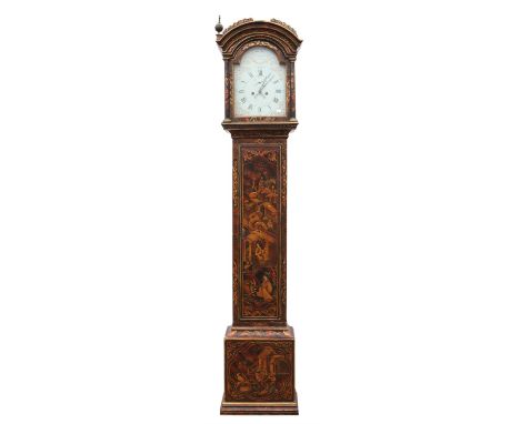 An early 19th century English longcase clock.  The arch top case with three brass finials over a painted tin dial plate detai