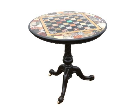 A Victorian marble topped occasional table, the chessboard top with specimen marble inlays, the ebonised base with cabriole l