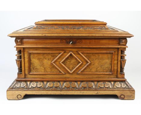 A Polyphon walnut cased music box, late 19th century, interior with inset trademark medallion, of sarcophagus form and with c