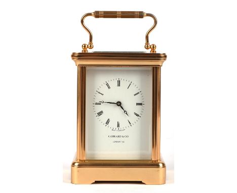 20th century brass four glass carriage clock, the dial bearing Roman numerals, marked for Garrard & Co, London W1 with brass 