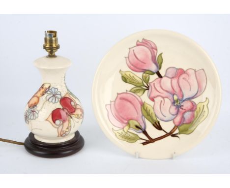 A Moorcroft table lamp, C.1990, tube line decorated with butterflies against a cream ground with cream shade, height 37cm and