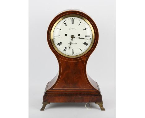 A Late 19th century mahogany and line inlaid mantel clock of balloon shape.  The white enamelled dial detailed LINKINSON DONC