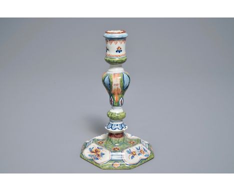 A polychrome Dutch Delft candlestick, 18th C.     H.: 19,5 cm  Marked in red on the base 'D 7', for Jan Teunis Dextra, the "D