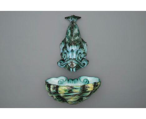 A rare Brussels faience dolphin-shaped fountain and basin, 18th C. Dim.: 46 x 30 x 23 cm (the basin) H.: 46 cm (the fountain)