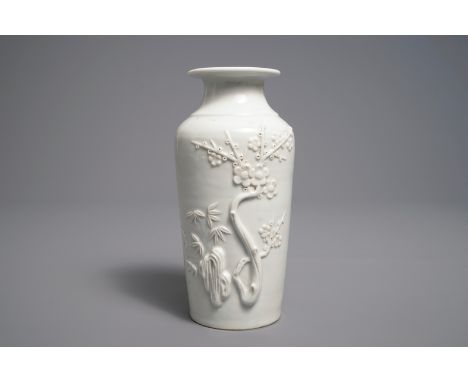 A Chinese Dehua blanc de Chine rouleau vase with incised and applied design, Kangxi     H.: 21 cm  Provenance: The collection