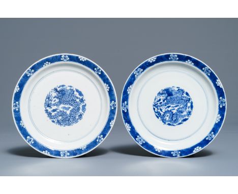 A pair of Chinese blue and white 'dragon' plates, Kangxi mark and of the period     Dia.: 16 cm         Condition reports and