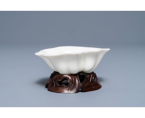A Chinese Dehua blanc de Chine lotus leaf-shaped brush washer on stand, Kangxi     Dim.: 10 x 7,5 x 3 cm  Provenance: - The c