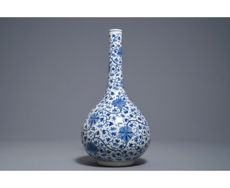 A Chinese blue and white 'lotus scroll' bottle vase, 18/19th C.     H.: 43 cm         Condition reports and high resolution p