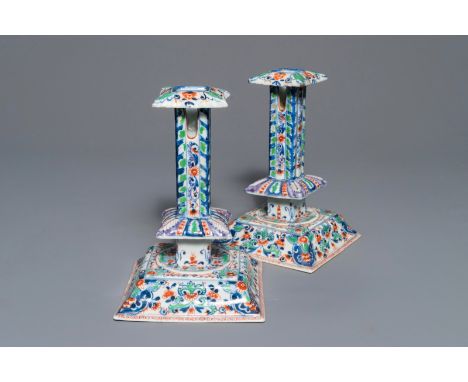 A pair of clobbered Chinese blue and white candlesticks, Kangxi     H.: 21 cm - L.: 14 cm         Condition reports and high 
