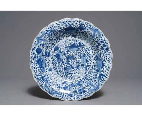 A lobed Chinese blue and white dish with fish, Kangxi     Dia.: 36 cm         Condition reports and high resolution pictures 