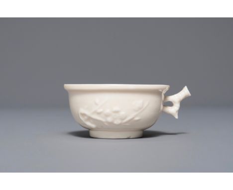 A Chinese Dehua blanc de Chine cup with applied design, seal mark, Kangxi     L.: 8,5 cm - H.: 3 cm  Provenance: The collecti