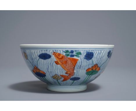 A Chinese doucai bowl with fish in a lotus pond, Xuande mark, Kangxi     Dia.: 18 cm - H.: 8,5 cm         Condition reports a