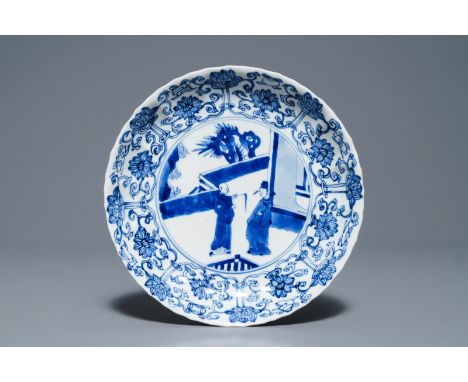 A Chinese blue and white moulded plate with figures on a terrace, Kangxi mark and of the period     Dia.: 20,5 cm         Con