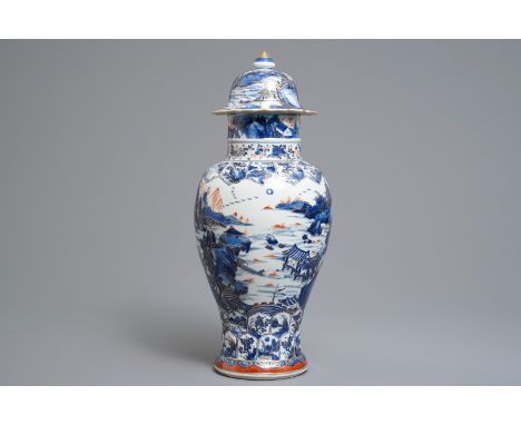 A Chinese clobbered blue and white vase and cover with landscape design, Kangxi     H.: 48 cm         Condition reports and h