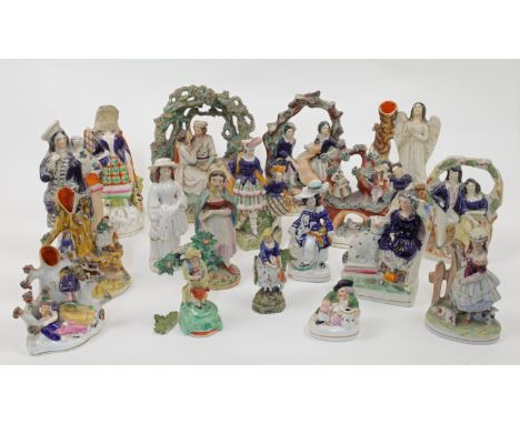 A group of Staffordshire ceramic figures and figure groups, 19th century, comprising: a figure group of a romantic couple sea