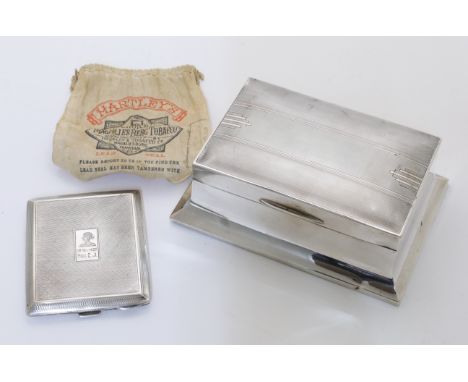 A silver cigarette box, Sheffield, 1934, Walker &amp; Hall, of rectangular form, on a spreading base, with engine turned desi