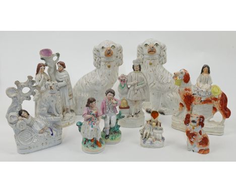 A group of Staffordshire figures and figure groups, 19th century, comprising: a pair of seated King Charles spaniels with pai