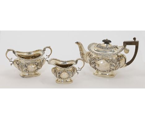 An Edwardian silver three-piece tea set, comprising: a teapot, a cream jug and a twin handled sugar bowl, Birmingham, 1901, J