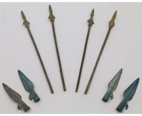Four Chinese parcel gilt bronze arrows and four arrow heads, 20th century, the arrows each with a thin shaft, gilt lacquered 