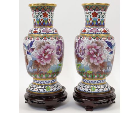 A pair of Chinese cloisonn&eacute; enamel 'peonies' vases, 20th century, each of baluster form, enamelled to the body with bi