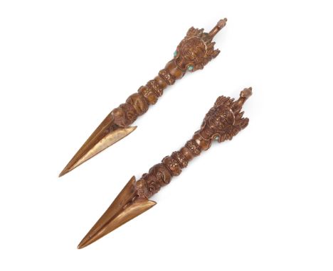 A pair of Tibetan gilt copper ritual pegs associated with the practice of Hayagriva, Phurba/vajrakīla, 19th century, the trip
