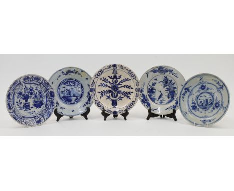 A group of Dutch Delft ware blue and white ceramic plates, 18th century, to include an example decorated with a vignette of a