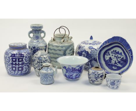A group of Chinese blue and white vessels, 20th century, comprising two jars and covers, 20cm and 27cm high, a small jar with