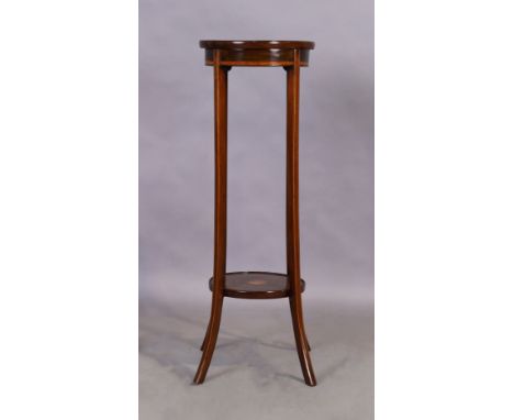 An Edwardian inlaid mahogany jardiniere stand, first quarter 20th century, 97cm high, 34cm diameter Condition Report:  light 